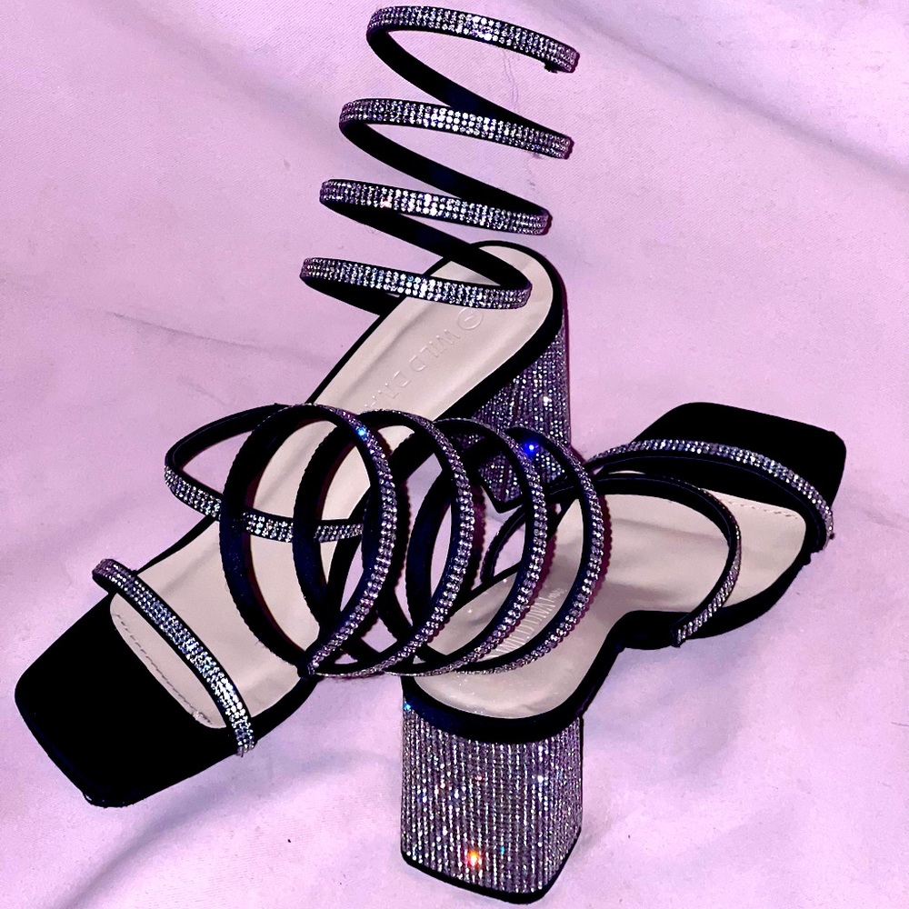 Never worn. Size 7 Black Diamond encrusted spiral strapped heels.